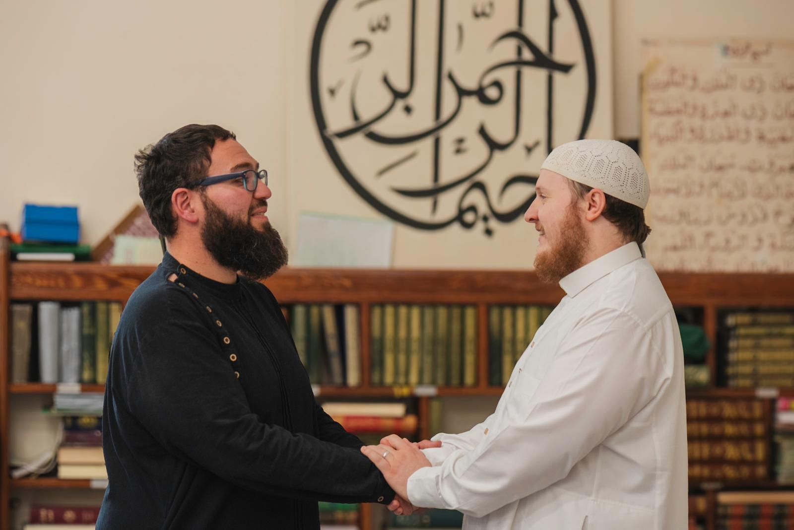 Two members of Bristol Revert Network greeting one another warmly